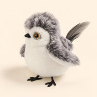 Pájaro Nieve de PawsAddict, blanco y gris con ojos ámbar